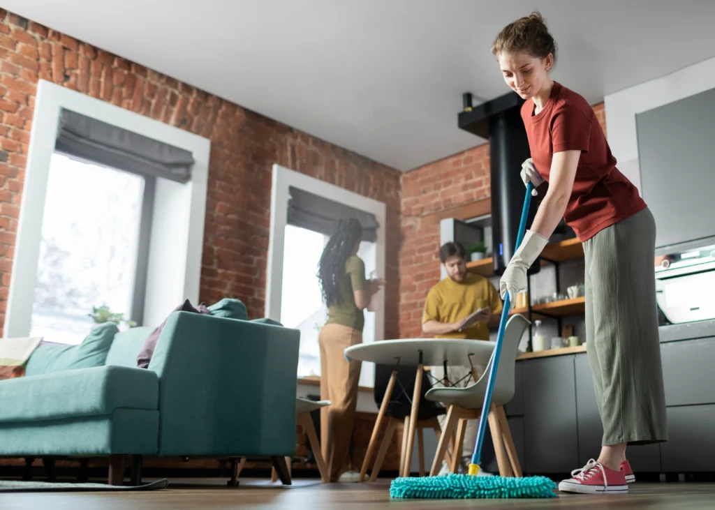Living room deep cleaning with vacuum and sanitizing tools